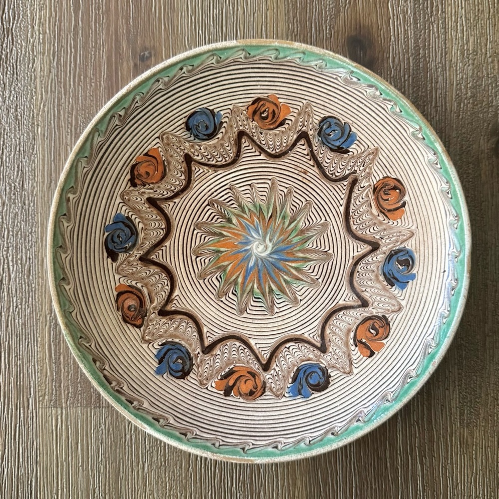 Artisan Ceramic Plate with Green, Blue, and Orange Patterns